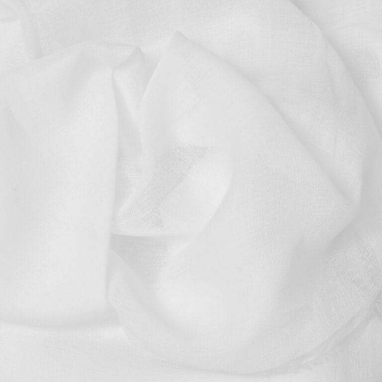 Close-up of sheer, lightweight white fabric with a soft, airy texture and gentle folds, creating a delicate and translucent appearance.