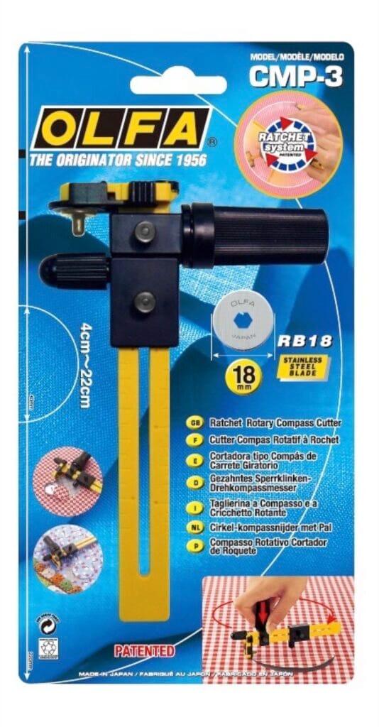 A packaged OLFA CMP-3 rotary compass cutter with a yellow and black handle, an 18mm RB18 blade, and a circular cutting arm, shown on a blue background with product details in multiple languages.
