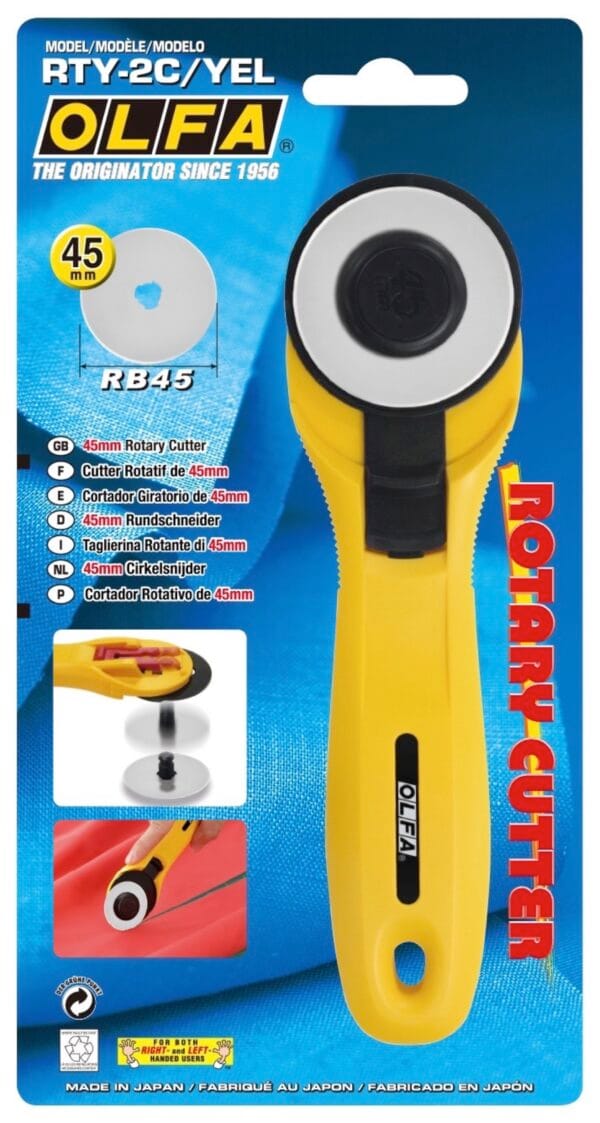 A yellow OLFA RTY-2C/YEL 45 mm rotary cutter in packaging, with product details, features, and images of the cutter in use on a blue background. The package highlights “ROTARY CUTTER” in red text on the right.