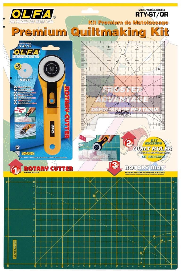 OLFA Premium Quiltmaking Kit packaging showing a rotary cutter, a clear grid quilt ruler, and a green cutting mat with yellow grid lines, designed for quilting and fabric cutting.