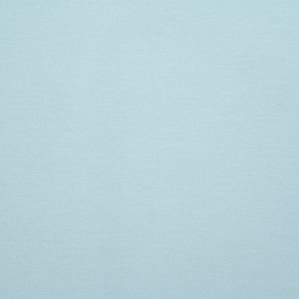 A close-up view of a light blue textured fabric with a subtle woven pattern and no visible objects or distinct features.