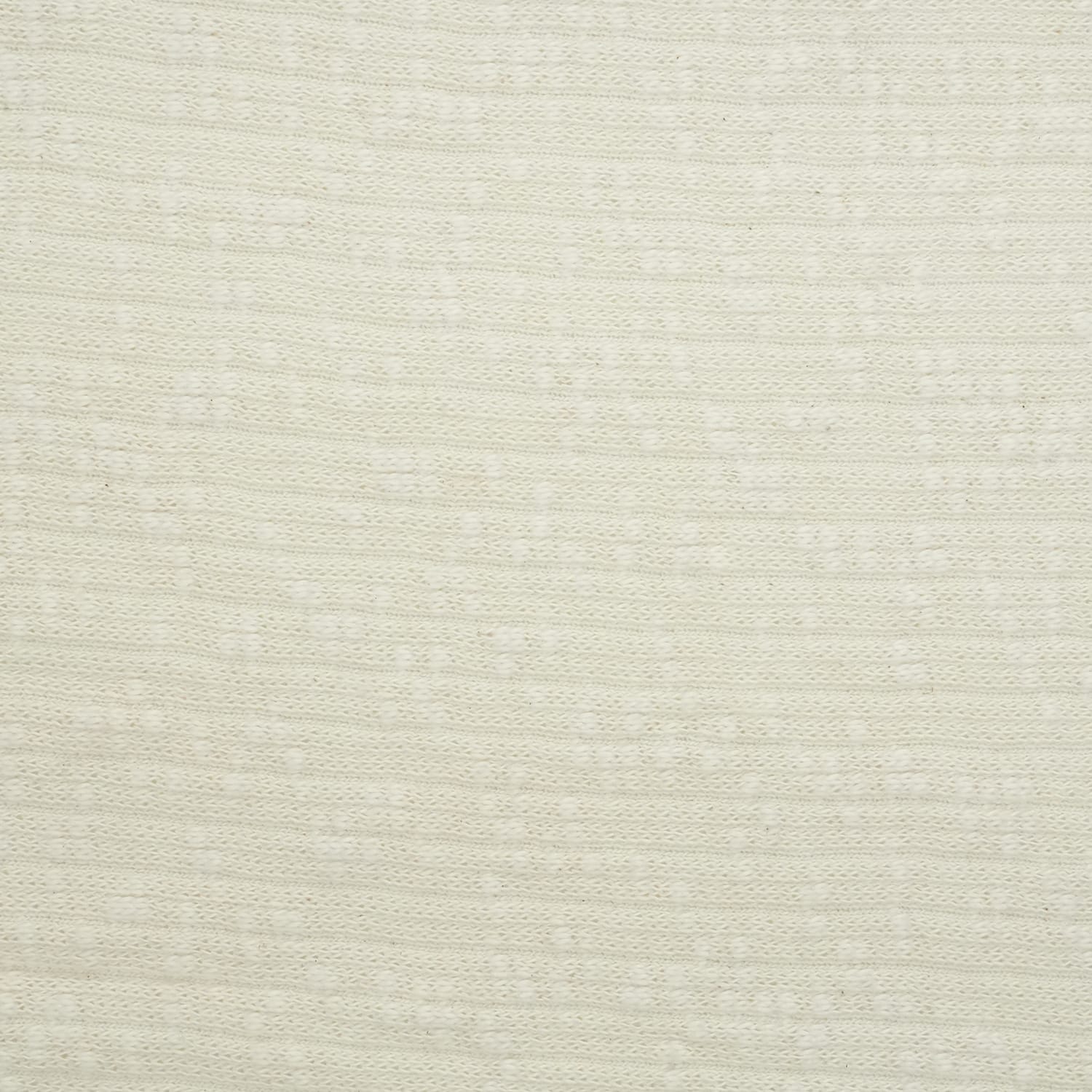 Cotton-Knitted-Cable-2 Close-up of a light beige, textured fabric with a subtle, horizontal stripe pattern. The material appears soft and evenly woven, with small, slightly raised dots and lines creating a gentle, repetitive design.