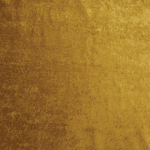 A close-up of a gold velvet fabric with a soft, slightly textured surface and a rich, shimmering appearance.