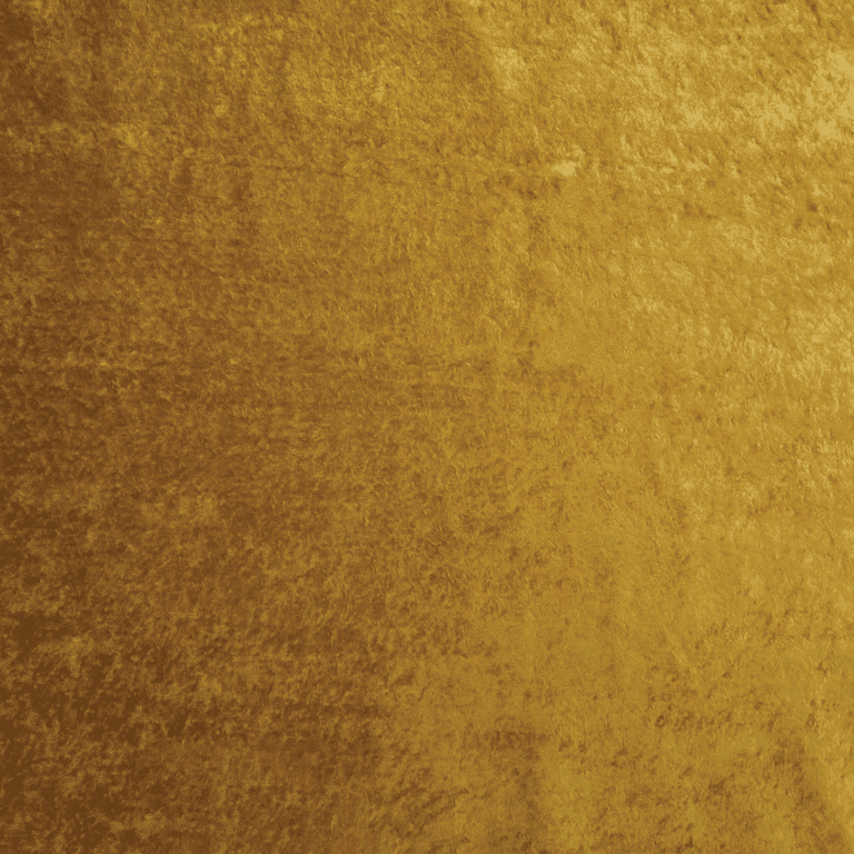 A close-up of a gold velvet fabric with a soft, slightly textured surface and a rich, shimmering appearance.