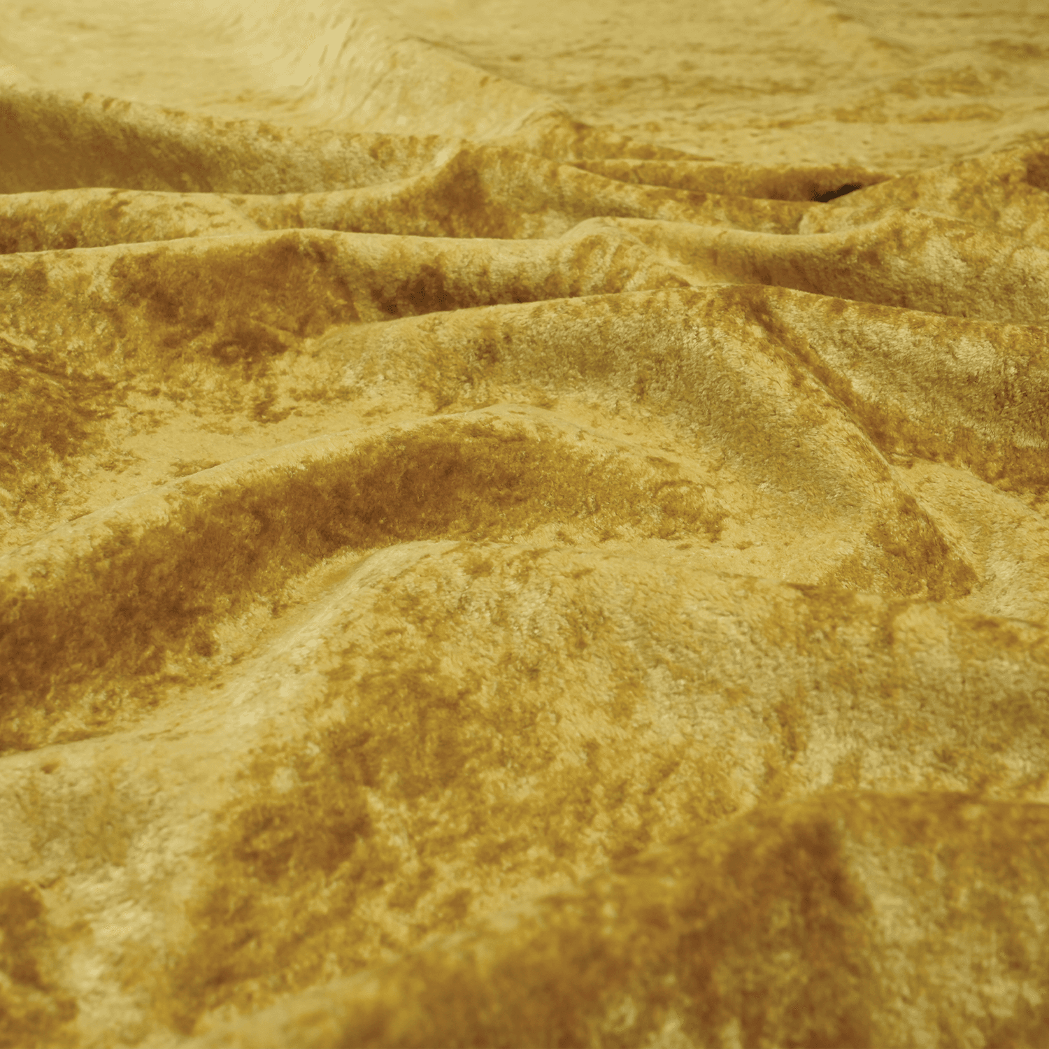 Carnival-Honey-3 A close-up view of soft, textured golden yellow fabric with gentle folds and ripples, creating a wavy surface and shimmering effect.