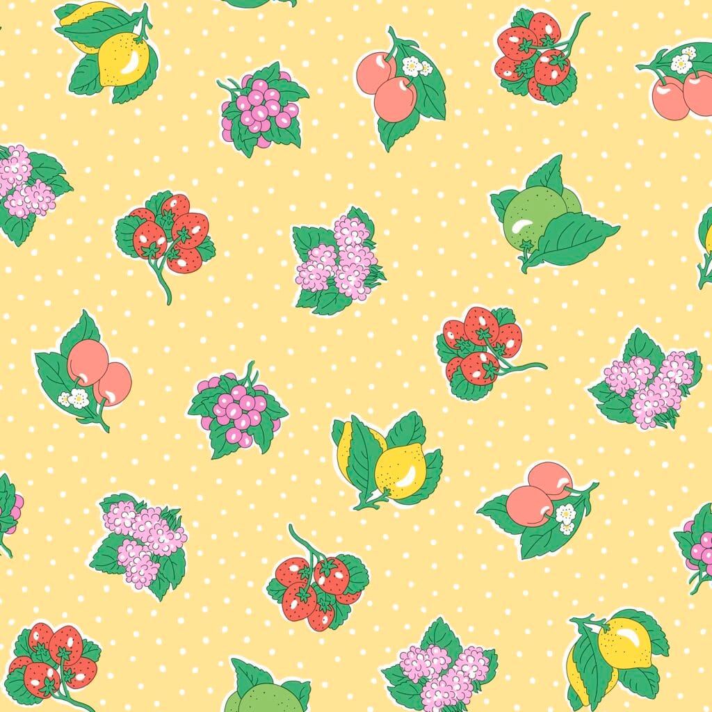 Seamless pattern of colorful fruits and flowers, including lemons, grapes, cherries, and clusters of pink blossoms, scattered over a light yellow background with small white polka dots.