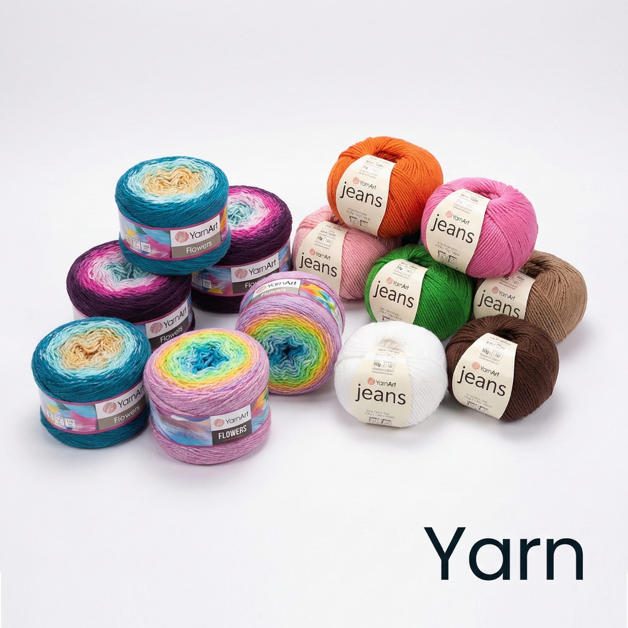 A variety of colorful yarn balls, including multicolored and solid shades like orange, green, brown, blue, pink, and white, are arranged on a white surface. The word 
