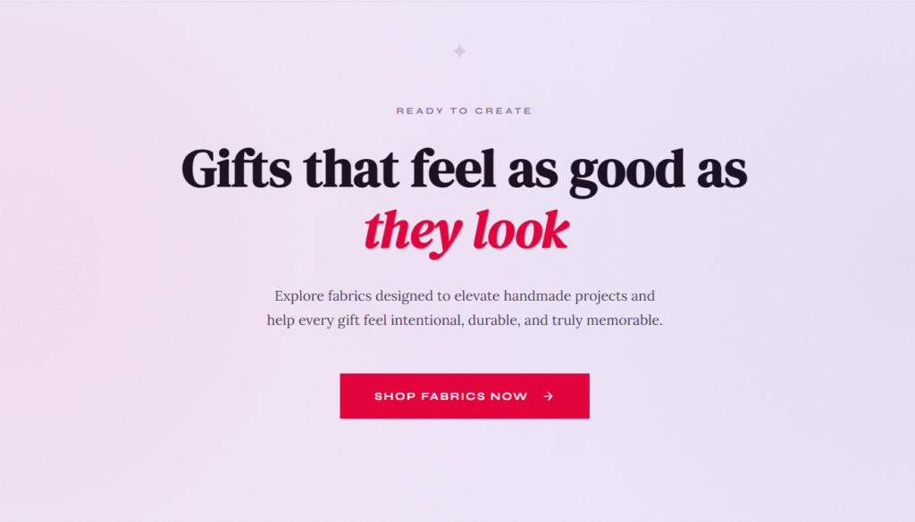 Centered text on a pink gradient background reads: "Gifts that feel as good as they look." Below is text about handmade fabrics, and a pink button labeled "Shop Fabrics Now" with a right arrow.