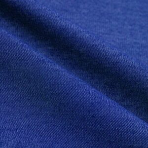 Close-up of Import placeholder for DNM14OZ_72 denim in deep blue, featuring a diagonal seam that highlights the material's texture and weave.