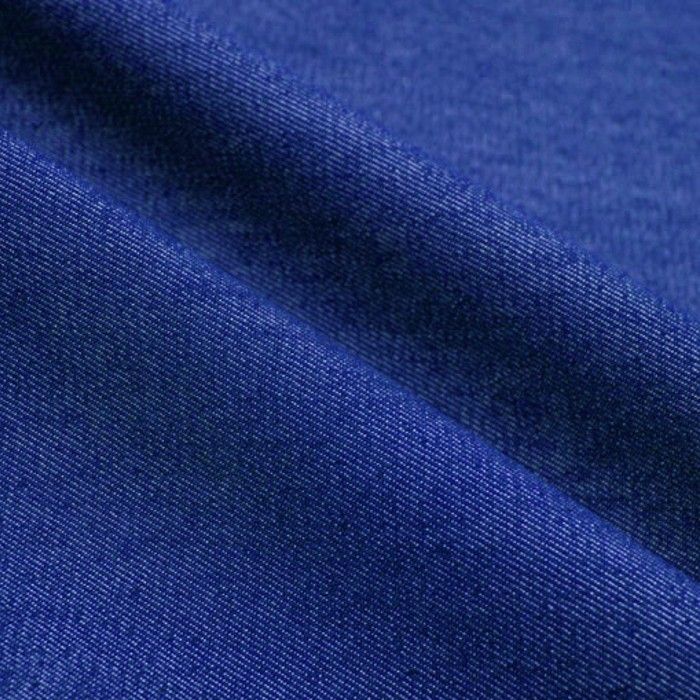 Close-up of Import placeholder for DNM14OZ_72 denim in deep blue, featuring a diagonal seam that highlights the material's texture and weave.