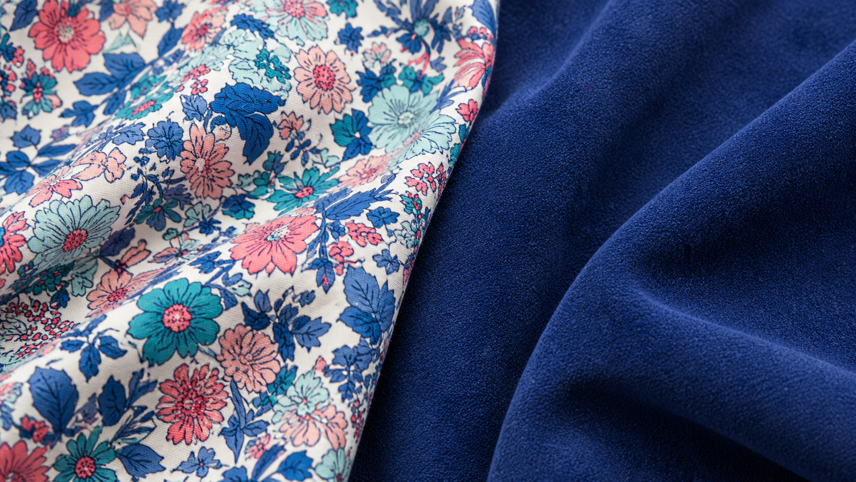 Flat lay of Liberty floral cotton, faux suede and coloured denim swatches arranged together